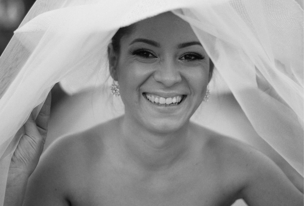 bride with hat smiling to camera