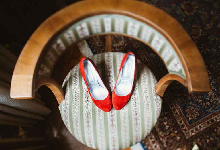 red wedding shoes on a chair