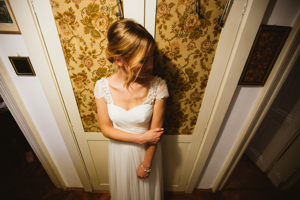 bride in front of shabby chic old door