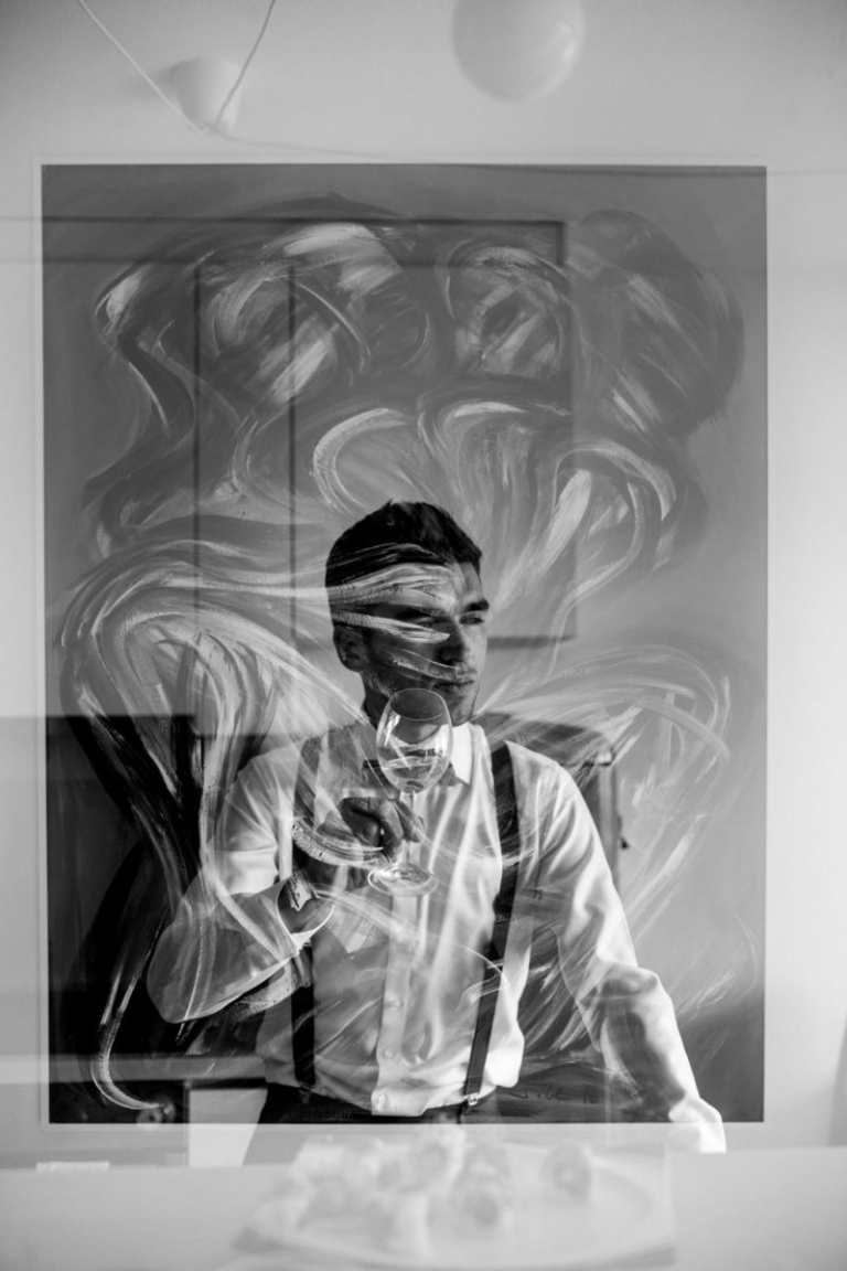 double exposure of a groom in his favourite modern art painting