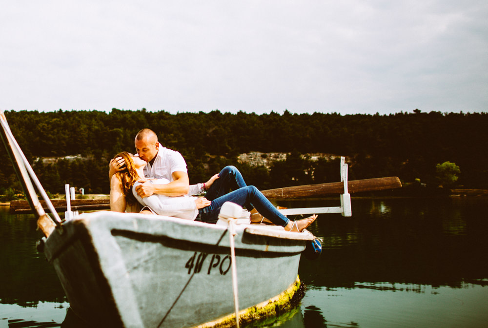bride and groom kiss on a boat in istria