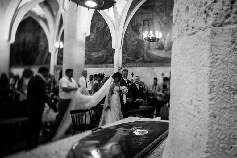 bride and groom in church exchanging vows