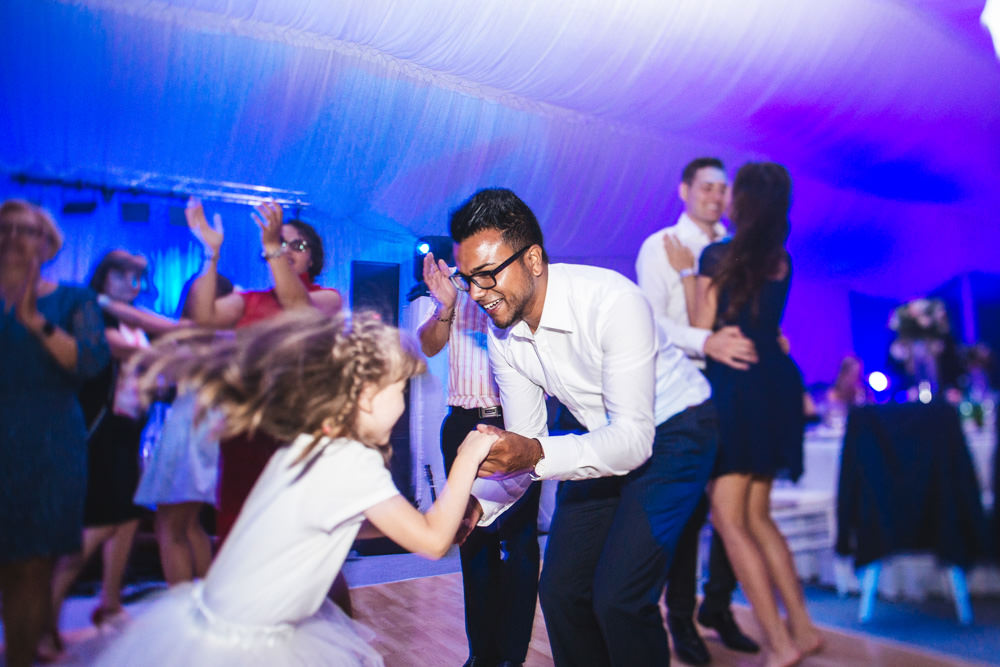 girl dancing with her father from switzerland in croatia wedding
