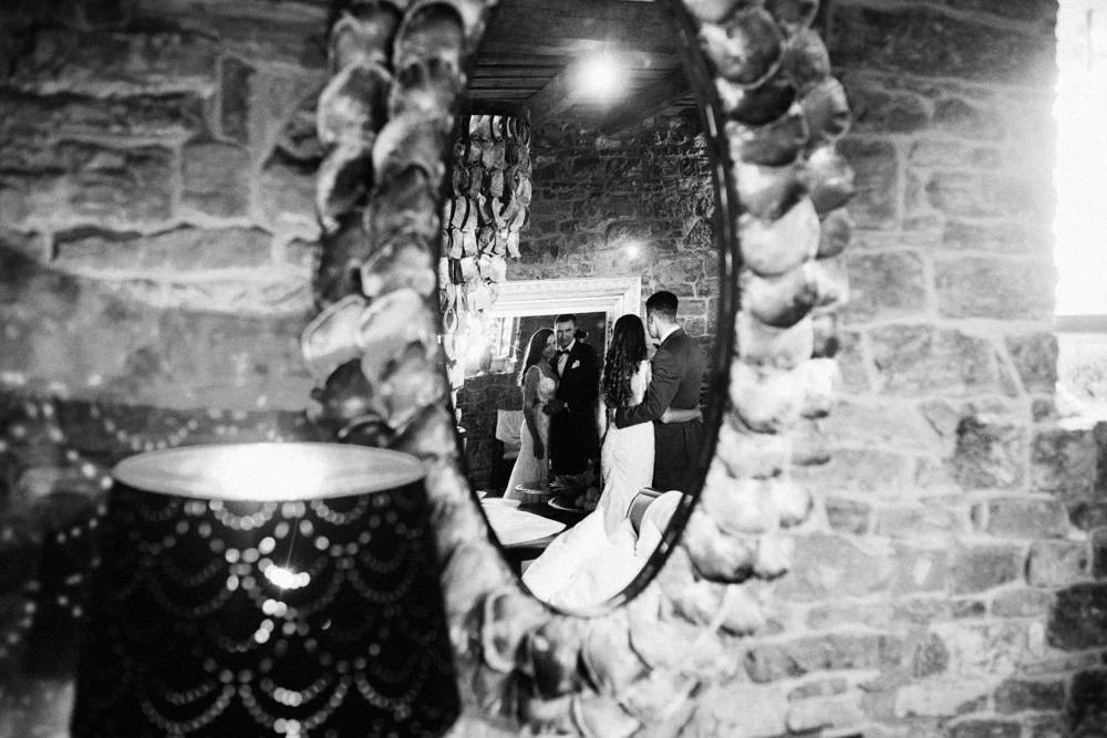 bride and groom relfexion in mirror in groznjan croatia
