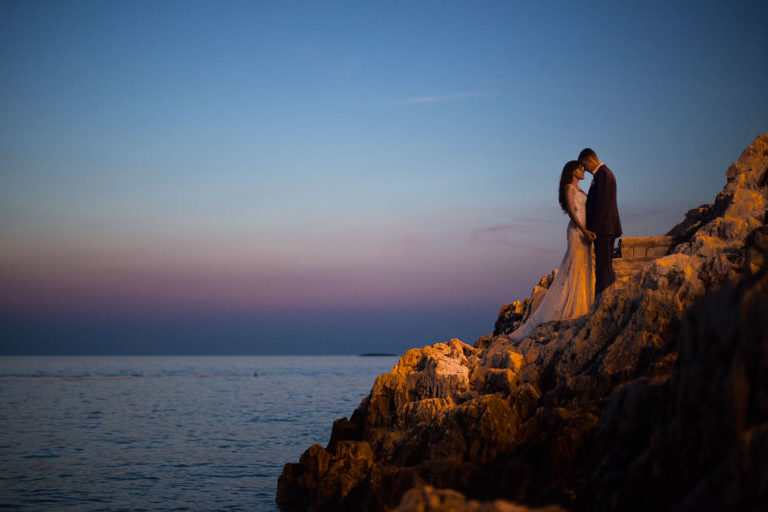 rovinj sunset newlyweds hug wedding dress